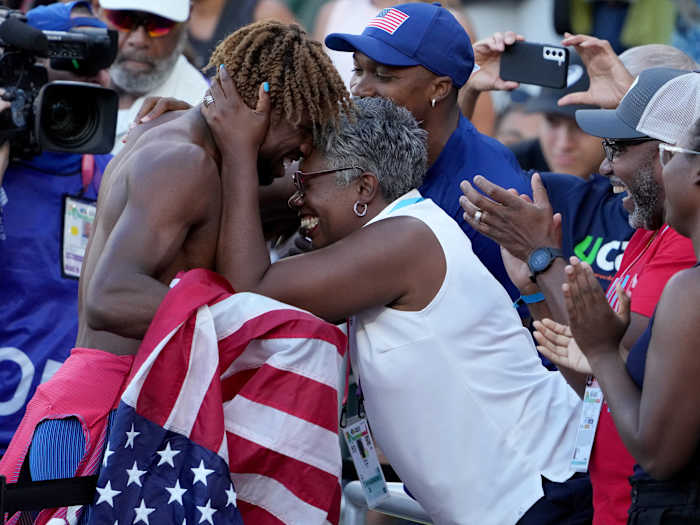 Noah Lyles celebrates with his mother after winning the 200 meter at the world championships.